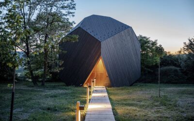 This rock-shaped wood cabin allows you to live in the woods in comfort