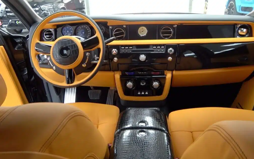 This custom build turns a Rolls-Royce Phantom into a 6x6 off-roader using BMW parts, crocodile leather, and gold trim inside and out