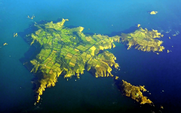 Island less than 100 miles from the UK where cars are totally banned and there are no paved roads