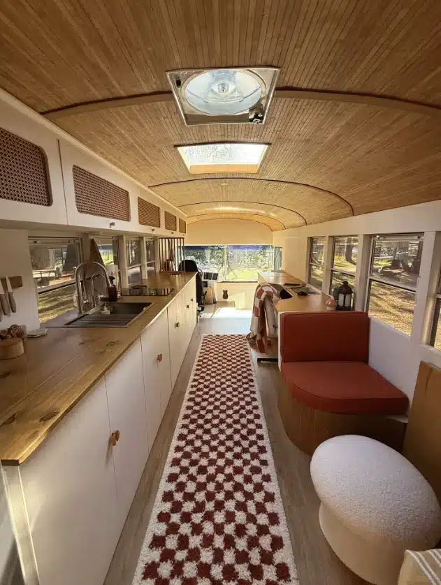A US couple has converted an old school bus into a cozy and spacious motorhome that they use to travel the world.