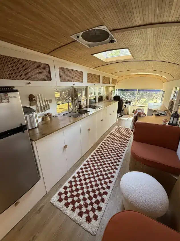 A US couple has converted an old school bus into a cozy and spacious motorhome that they use to travel the world.