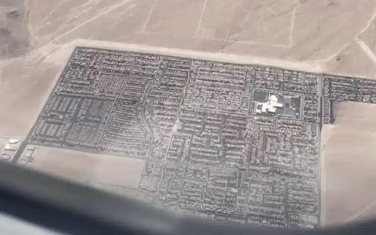 A plane passenger looked out the window mid-flight and realized Las Vegas is just a tiny neon island in a giant beige desert – and the internet had thoughts