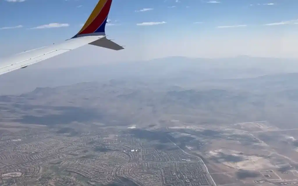 A plane passenger looked out the window mid-flight and realized Las Vegas is just a tiny neon island in a giant beige desert – and the internet had thoughts