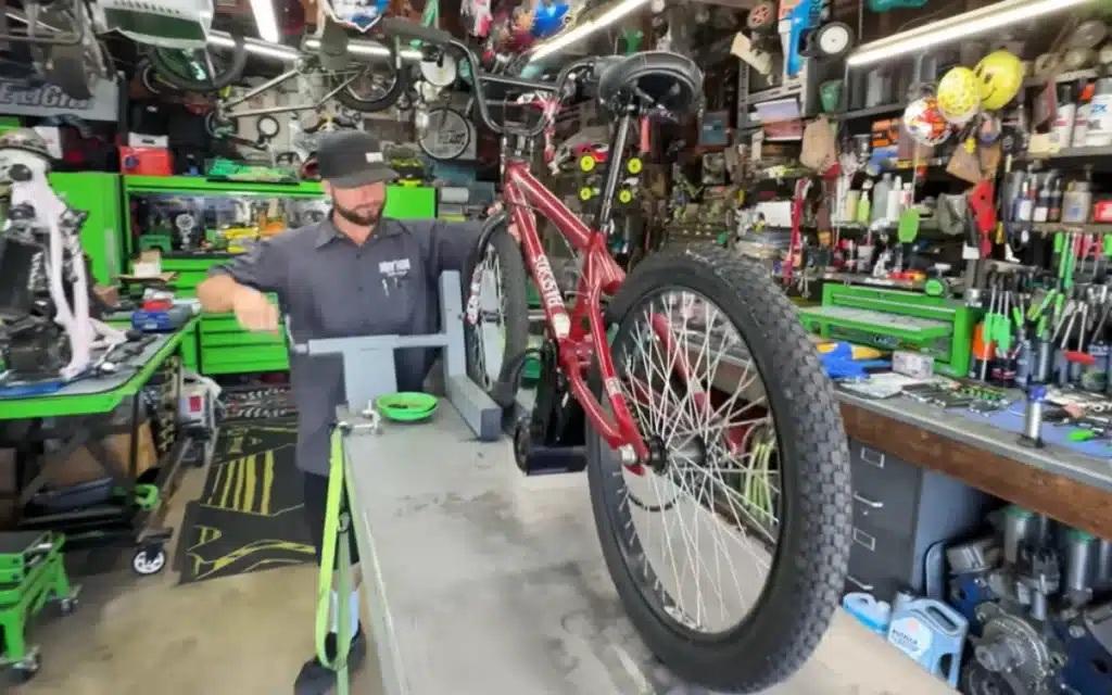 Watch a YouTuber's wild DIY e-bike experiment turn a $20 BMX into a 6,000-watt street rocket with hilariously chaotic results