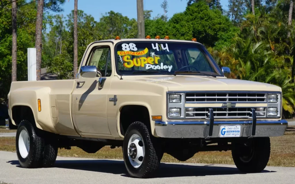 A 1988 Chevy K3500 Silverado with just 55 miles sold for $100,000, sparking debate over whether untouched originality beats modern truck tech