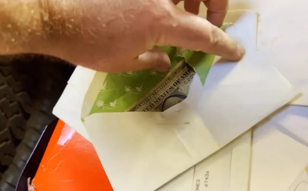 A Kansas man opened a locked abandoned semi-trailer expecting junk but instead found something far more unexpected hidden inside a long-forgotten suitcase