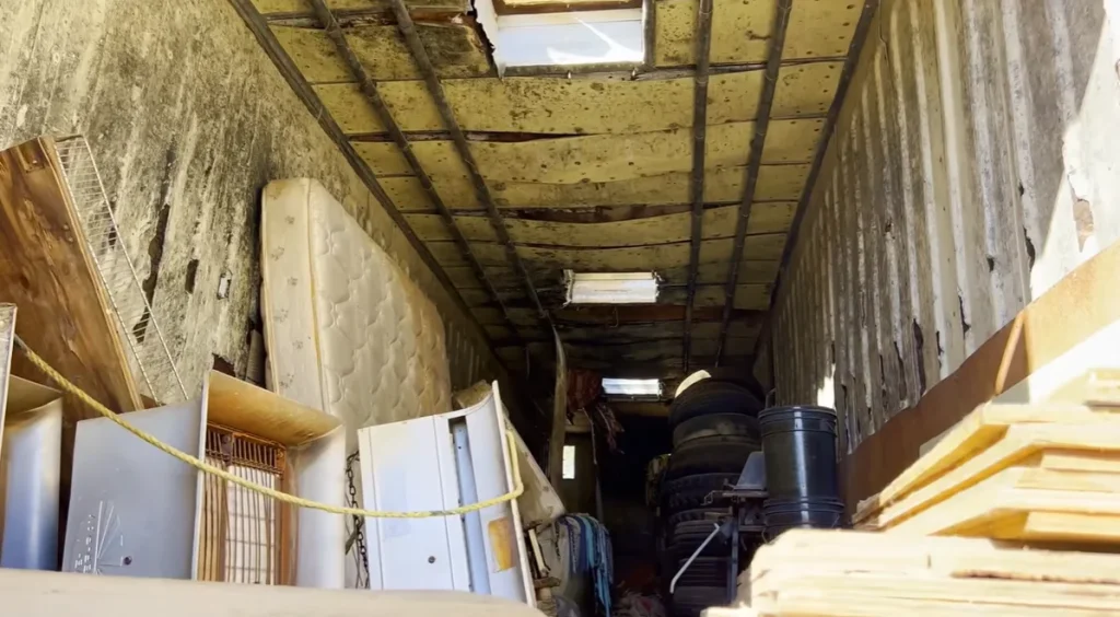 A Kansas man opened a locked abandoned semi-trailer expecting junk but instead found something far more unexpected hidden inside a long-forgotten suitcase