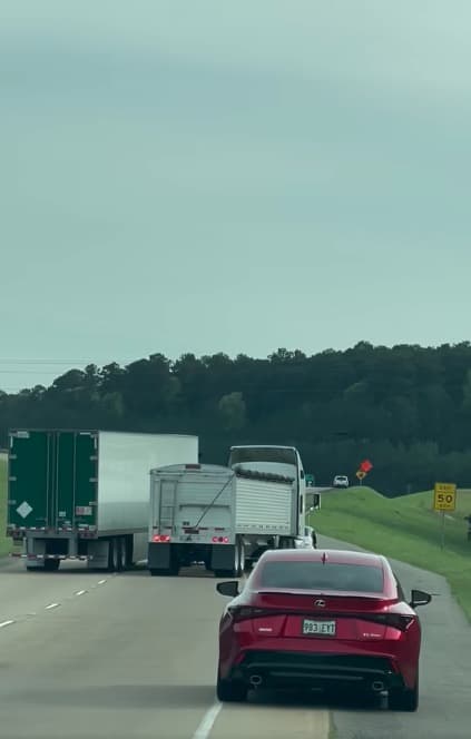 Trucks try to force each other off the road