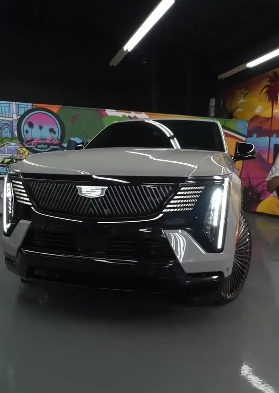 In the midst of selling cars, Shaq's new Cadillac Escalade IQ was revealed and it's the first of its kind