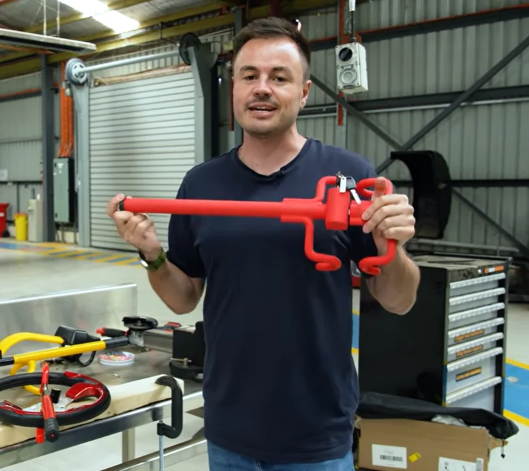 Man uses an angle grinder on Toyota's $200 steering wheel lock and a $30 steering wheel lock and there's a shock result