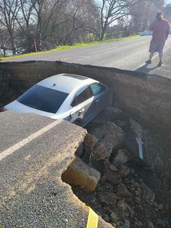 Stupid driver drives into sinkhole