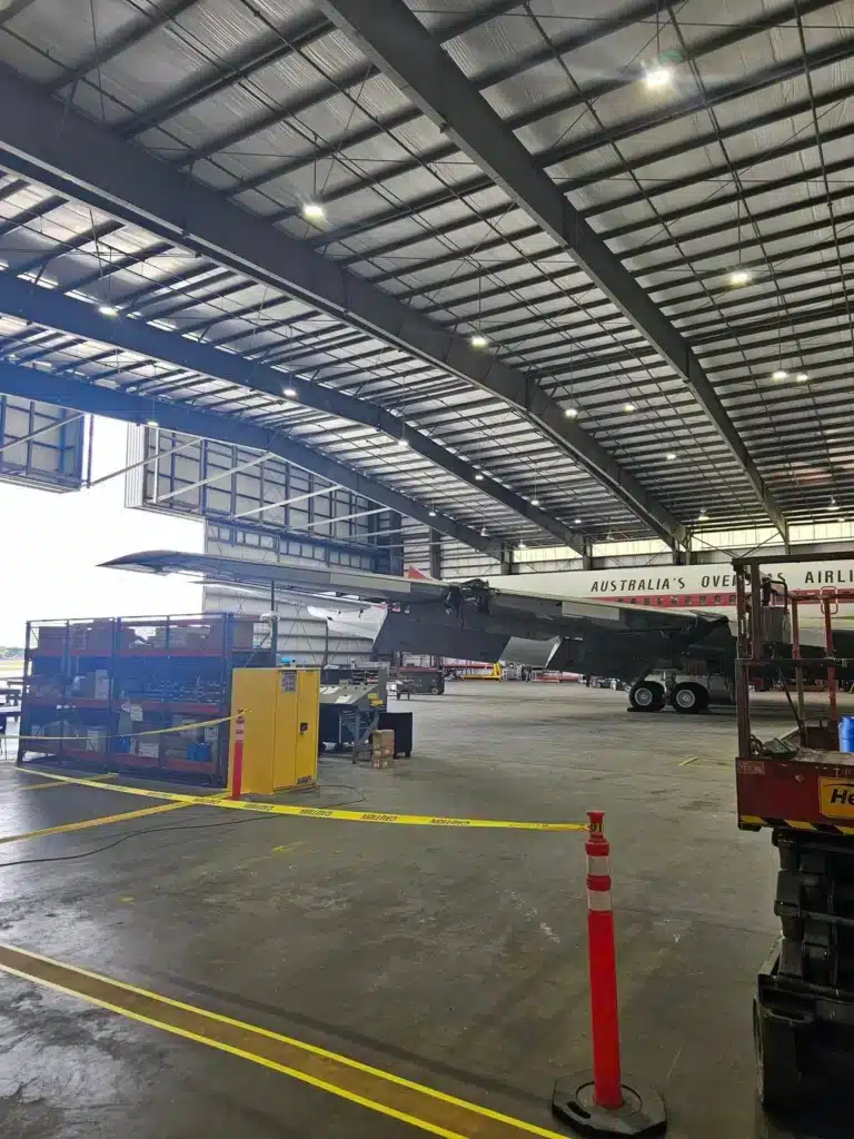 John Travolta's iconic Qantas Boeing 707 has been spotted lying in a parking lot with its tail rotting away.