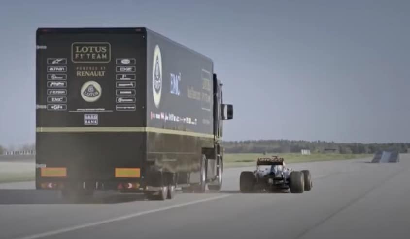 Truck jumps over F1 car in Lotus stunt