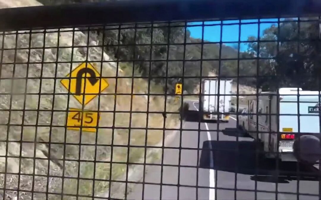 Terrifying moment truck’s brakes FAIL sending it hurtling down a busy mountain road