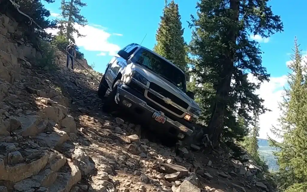 stuck Chevy Silverado pickup truck rescued from off-roading mountain