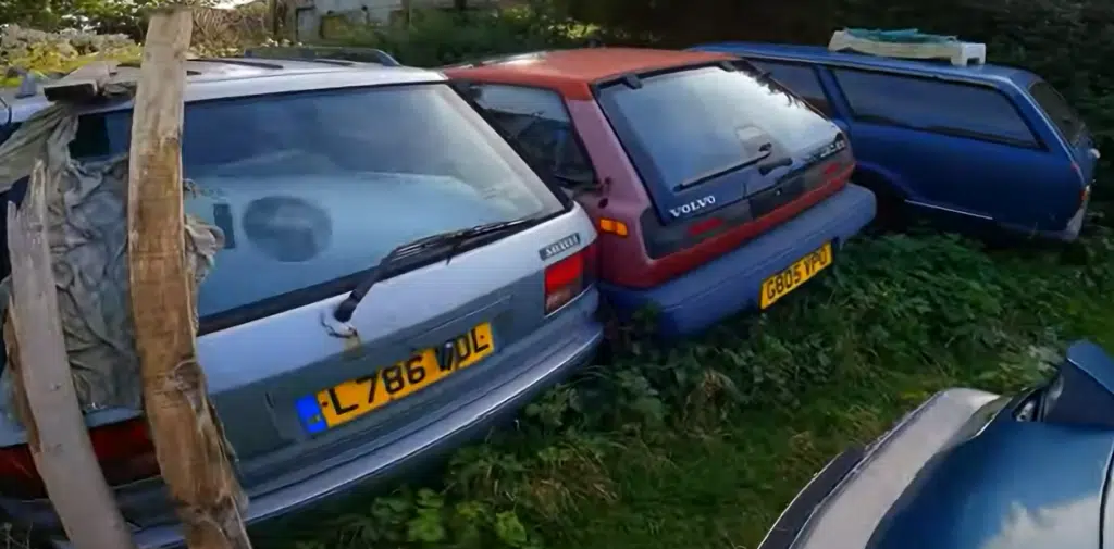 Man goes to abandoned property with a seemingly normal garden, only it's jampacked with vintage cars