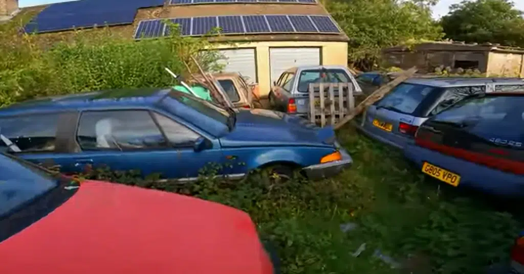 Man goes to abandoned property with a seemingly normal garden, only it's jampacked with vintage cars