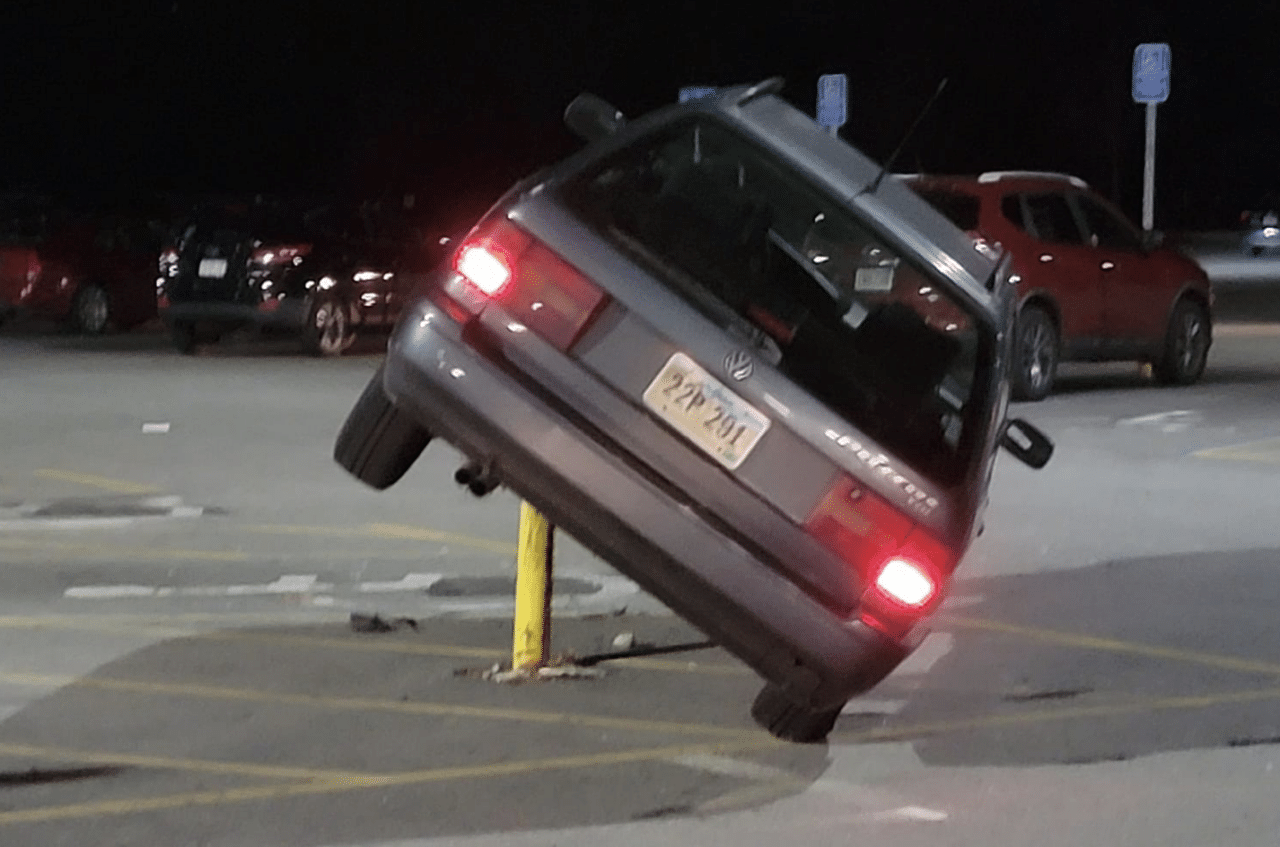 Hey, you can't park there! Driver impales car on pole in parking fail