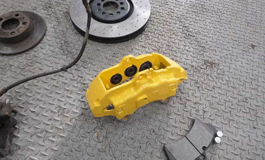 A YouTuber buys a $1,065 Volkswagen Golf to redo the disastrous build he attempted at 17, this time with the Porsche wheels and brakes he always wanted