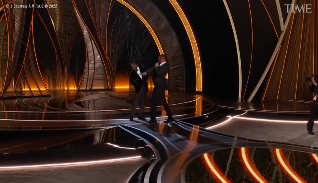 A video still of Will Smith appear to slap Chris Rock at the Oscars.