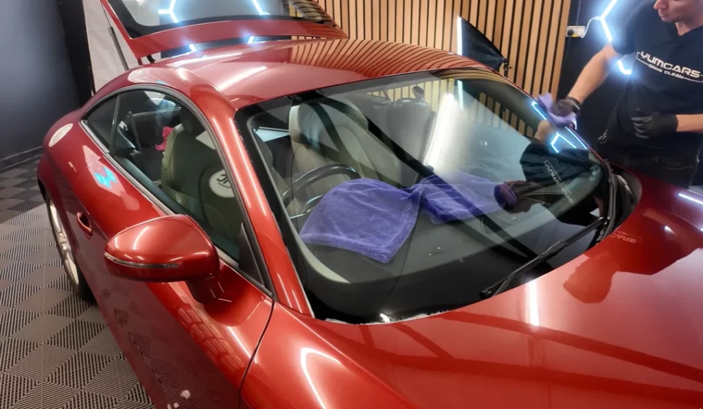 A pro detailer reveals the real cause of that stubborn interior windshield haze and the simple squeegee trick to clear it for good