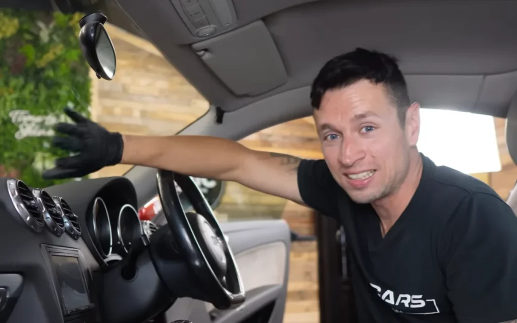 A pro detailer reveals the real cause of that stubborn interior windshield haze and the simple squeegee trick to clear it for good
