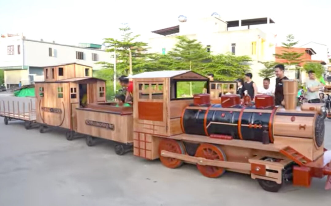 Vietnamese dad builds incredible wooden train for the kids in his village