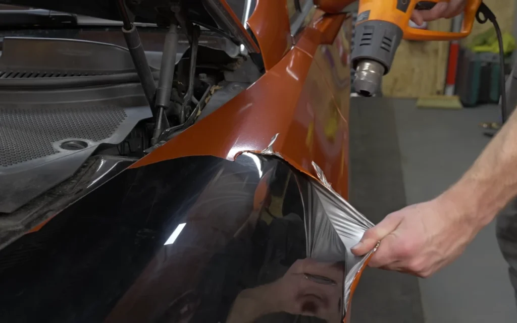 A YouTuber decided to peel the bright orange wrap off his cheap Bentley Continental GT and see what secrets the luxury coupe had been hiding for years. 