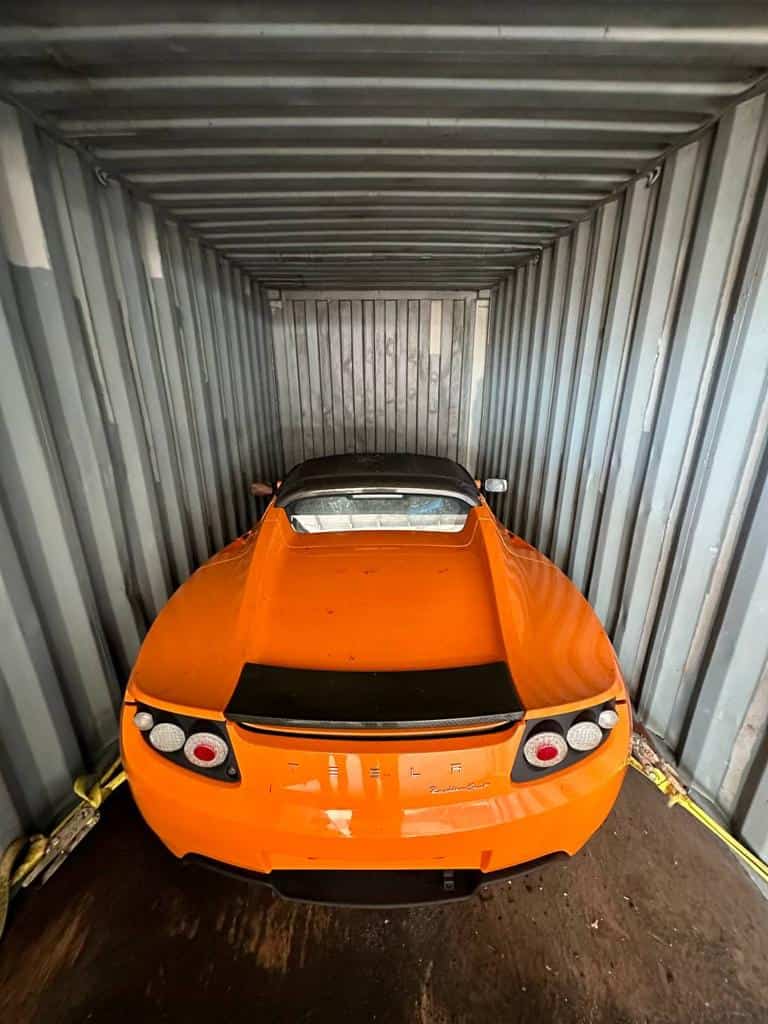 zero-mile Tesla Roadsters, orange