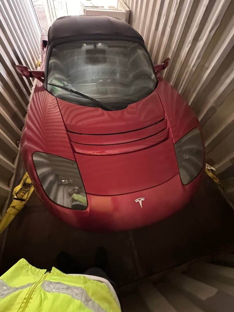 zero-mile Tesla Roadsters, red